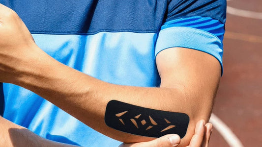Black Easy Kinesiology Tape pre-cut strip with diamond cut-outs applied to a forearm