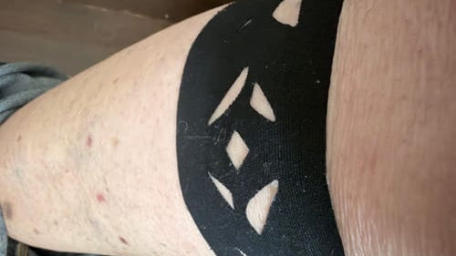 A verified customer's review photo — Easy Tape's diamond-cut strip worn on the leg